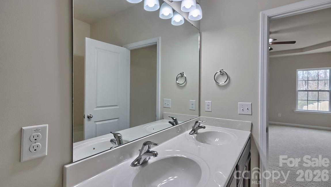 109 Piney Wds Road Fletcher, NC 28732 - Photo 21 of 28 a bathroom with a double vanity sink and a mirror