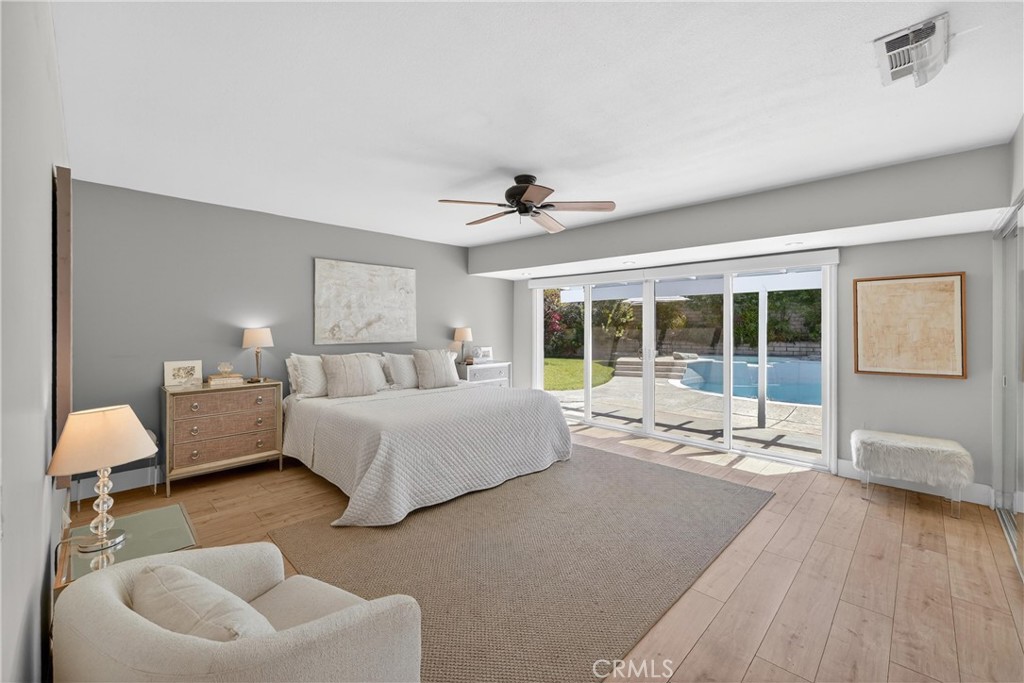 945 Le Conte Drive Riverside, CA 92507 - Photo 19 of 36 Beautiful Primary Bedroom with sliders and view of backyard. Electronic Shades on slider window.