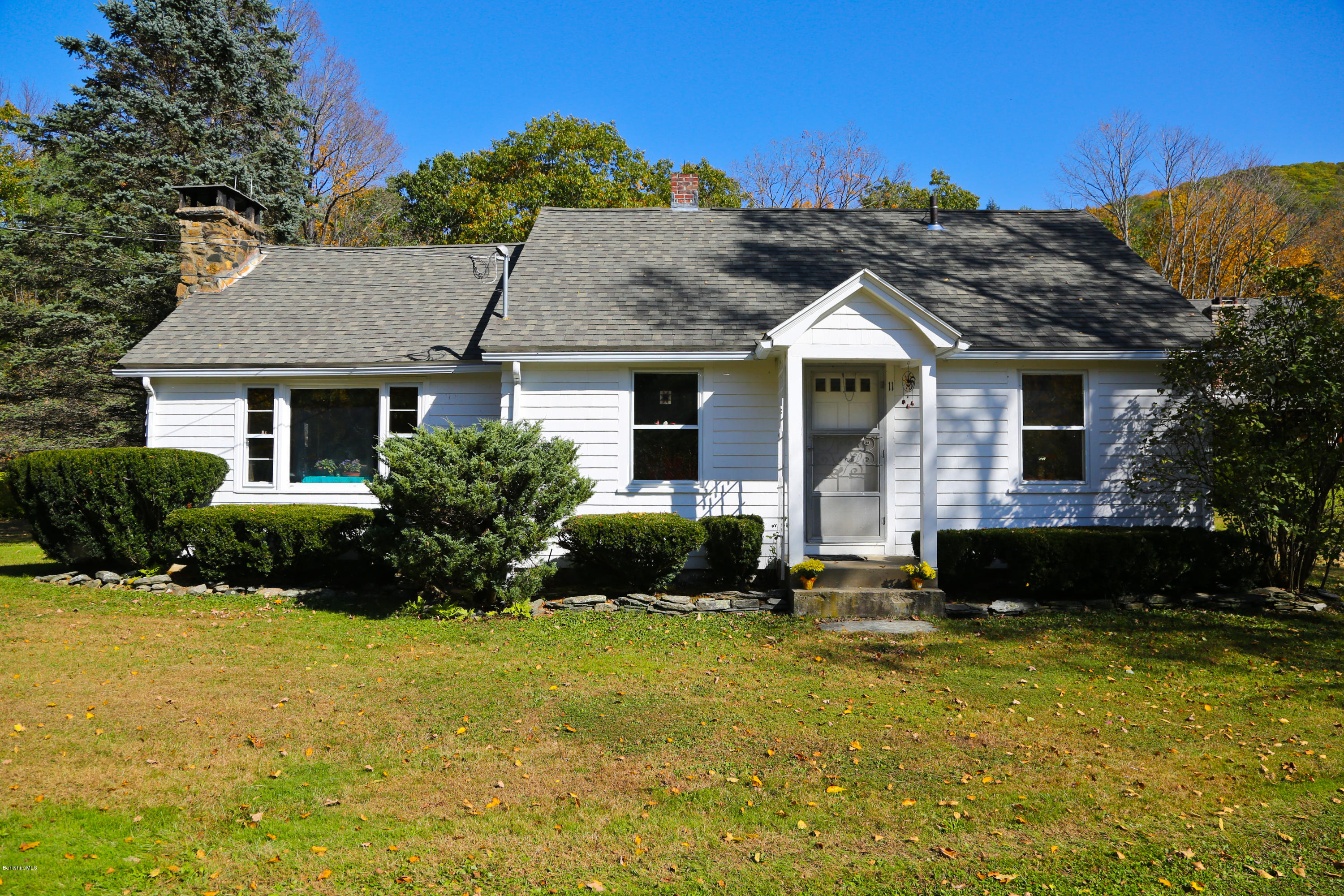 11 Johnson Hill Road Chester, MA 01011 - Photo 31 of 46 a front view of a house with a yard