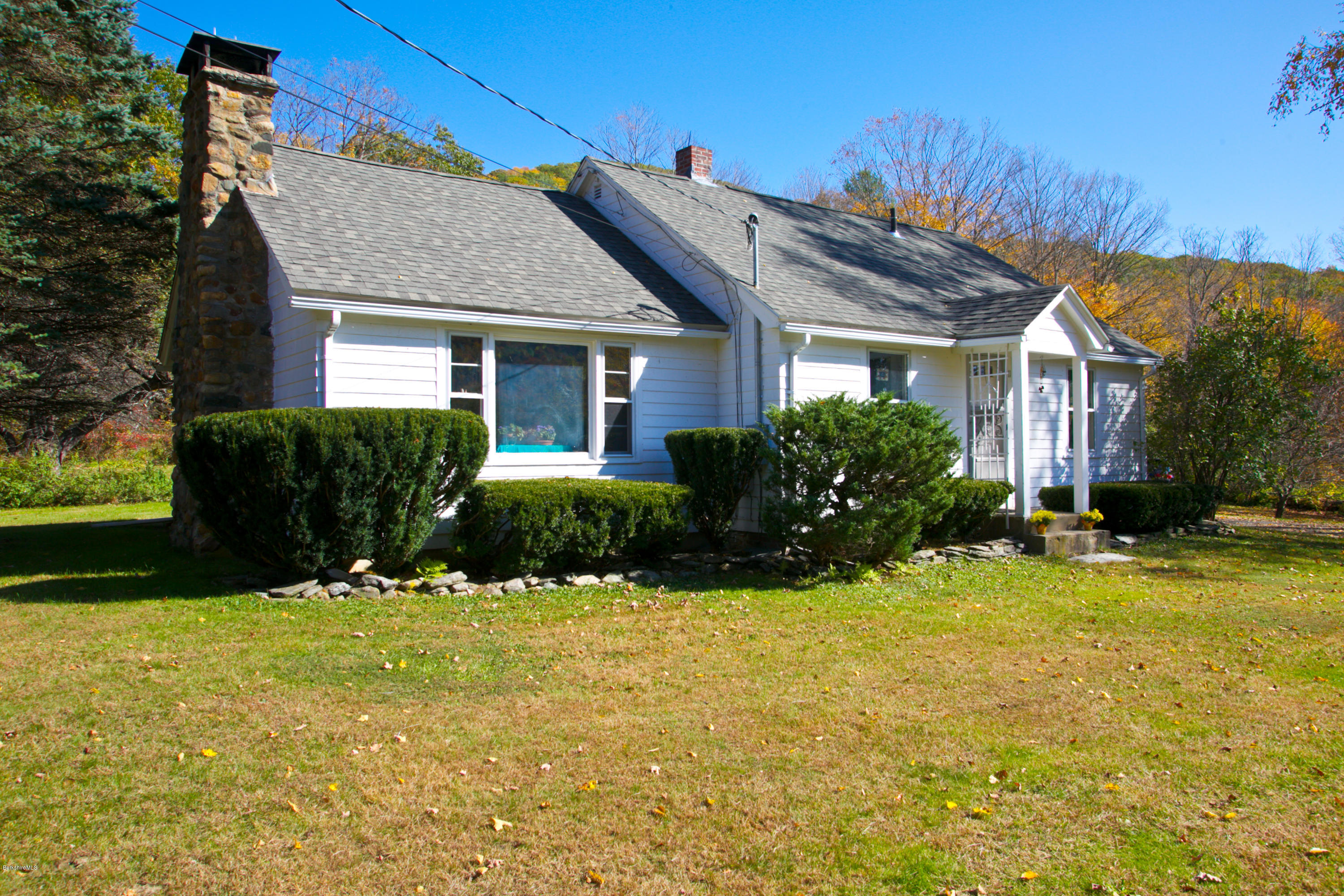 11 Johnson Hill Road Chester, MA 01011 - Photo 33 of 46 a front view of a house with yard and green space