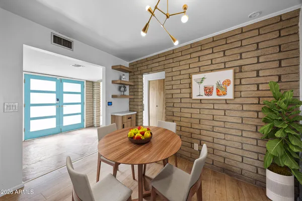 a large kitchen with granite countertop a large counter top space appliances and cabinets