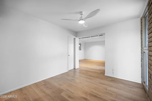 a bedroom with a large bed and a couch