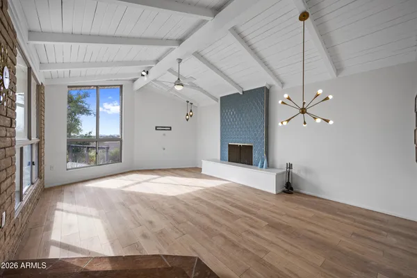 a living room with furniture a table and a flat screen tv