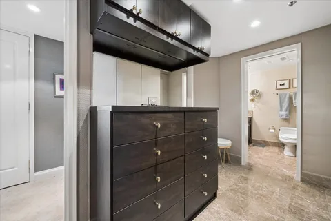 a kitchen with a refrigerator and a sink