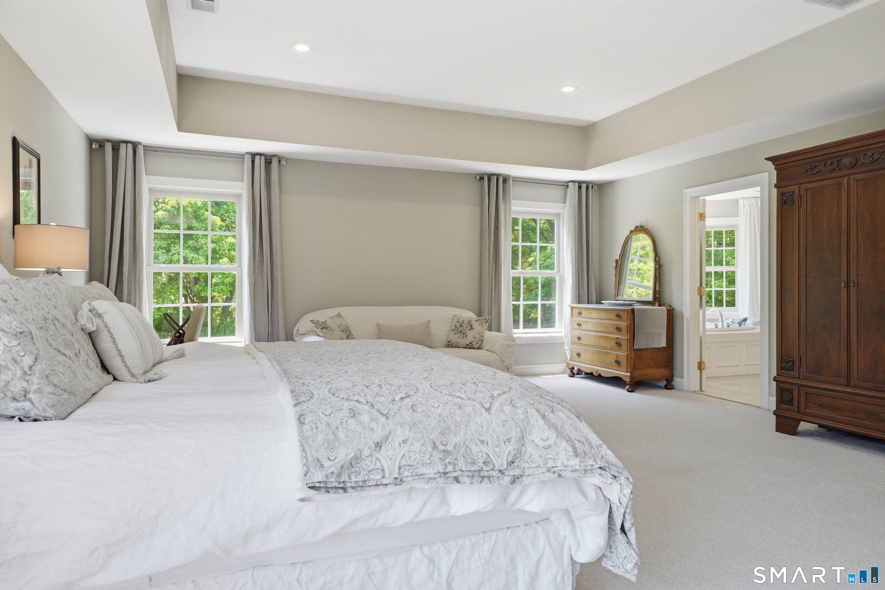 474 State Street Guilford, CT 06437 - Photo 22 of 40 a bedroom with a large bed and a large window