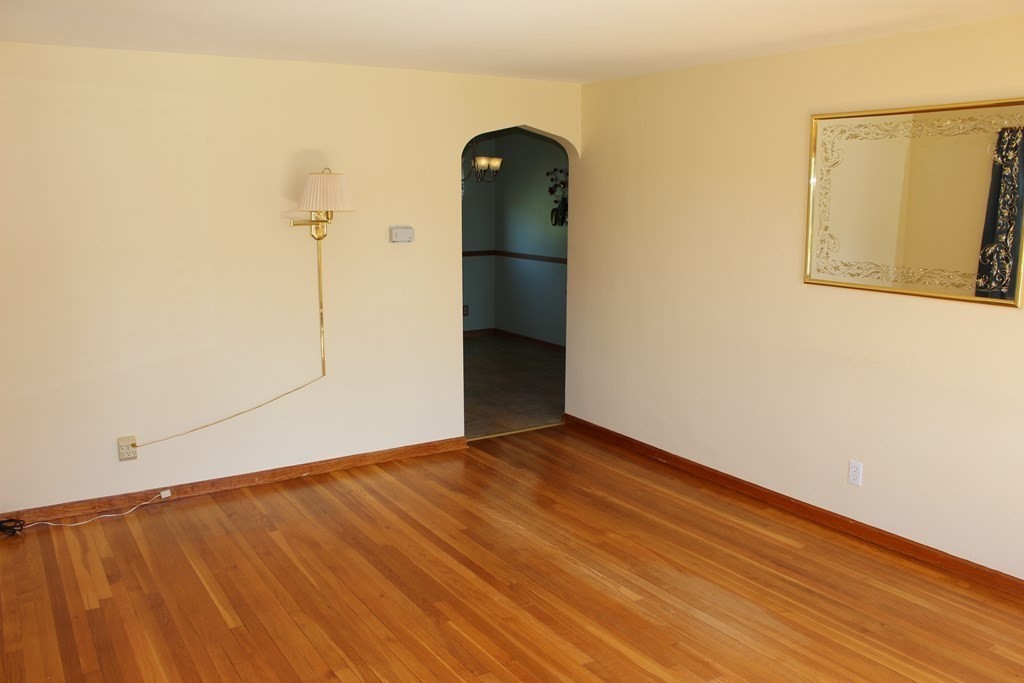 32 Randall Street Chicopee, MA 01013 - Photo 12 of 28 a view of a room with wooden floor and brick wall