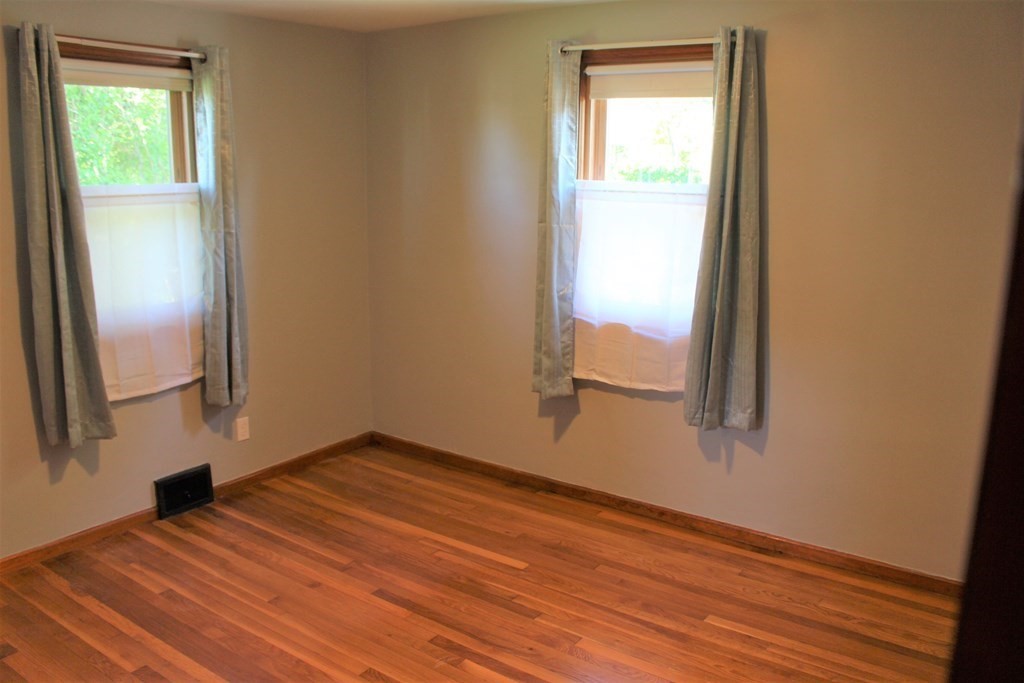 32 Randall Street Chicopee, MA 01013 - Photo 15 of 28 a view of empty room with wooden floor and fan