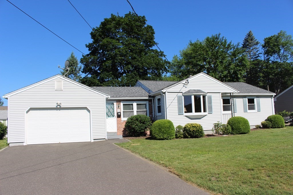 32 Randall Street Chicopee, MA 01013 - Photo 3 of 28 a front view of a house with a garden