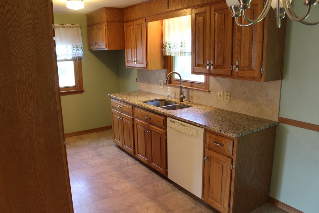 32 Randall Street Chicopee, MA 01013 - Photo 8 of 28 a kitchen with sink cabinets and window