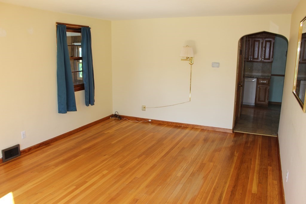 32 Randall Street Chicopee, MA 01013 - Photo 10 of 28 an empty room with wooden floor and closet