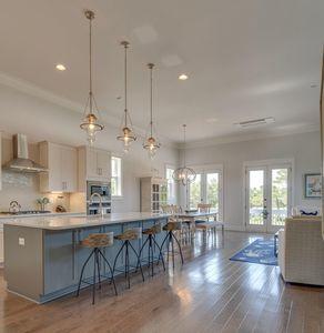 7 Grande Pointe Dr Inlet Beach Inlet Beach, FL 32461 - Photo 20 of 61 a kitchen with stainless steel appliances granite countertop a refrigerator a sink dishwasher a stove and white cabinets with wooden floor