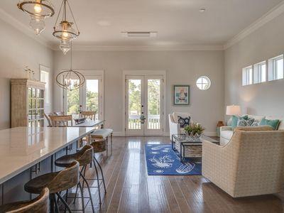 7 Grande Pointe Dr Inlet Beach Inlet Beach, FL 32461 - Photo 22 of 61 a very nice looking dining room with hardwood floor and a chandelier