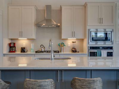 7 Grande Pointe Dr Inlet Beach Inlet Beach, FL 32461 - Photo 24 of 61 a kitchen with stainless steel appliances granite countertop a sink a stove and a refrigerator
