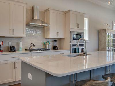 7 Grande Pointe Dr Inlet Beach Inlet Beach, FL 32461 - Photo 26 of 61 a kitchen with stainless steel appliances granite countertop a sink a stove and cabinets