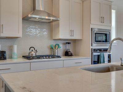 7 Grande Pointe Dr Inlet Beach Inlet Beach, FL 32461 - Photo 27 of 61 a kitchen with stainless steel appliances granite countertop a sink a stove and cabinets
