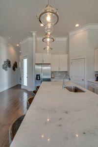 7 Grande Pointe Dr Inlet Beach Inlet Beach, FL 32461 - Photo 28 of 61 a kitchen with a sink chandelier and refrigerator