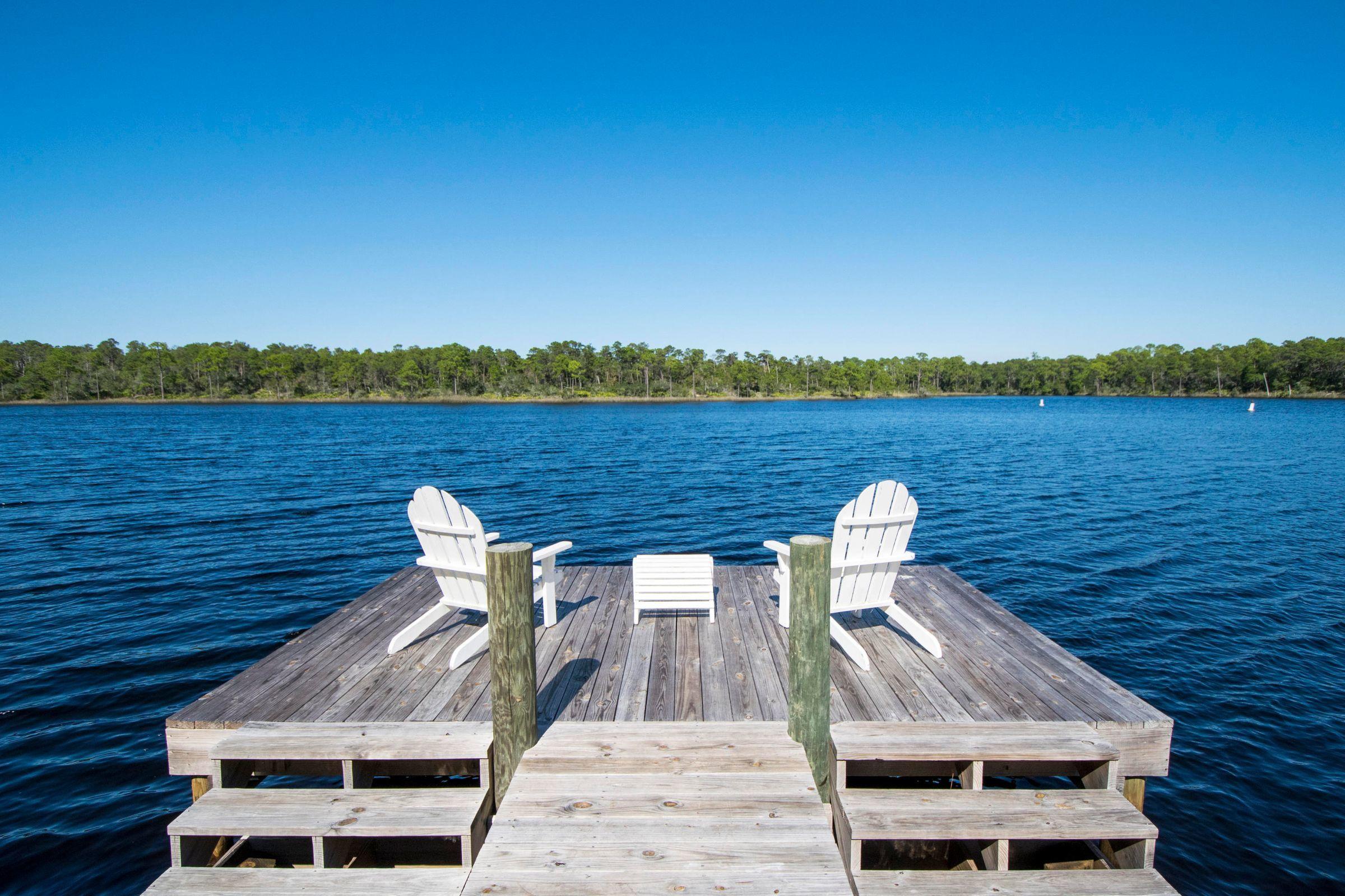 7 Grande Pointe Dr Inlet Beach Inlet Beach, FL 32461 - Photo 59 of 61 a view of a terrace with two chairs and a table