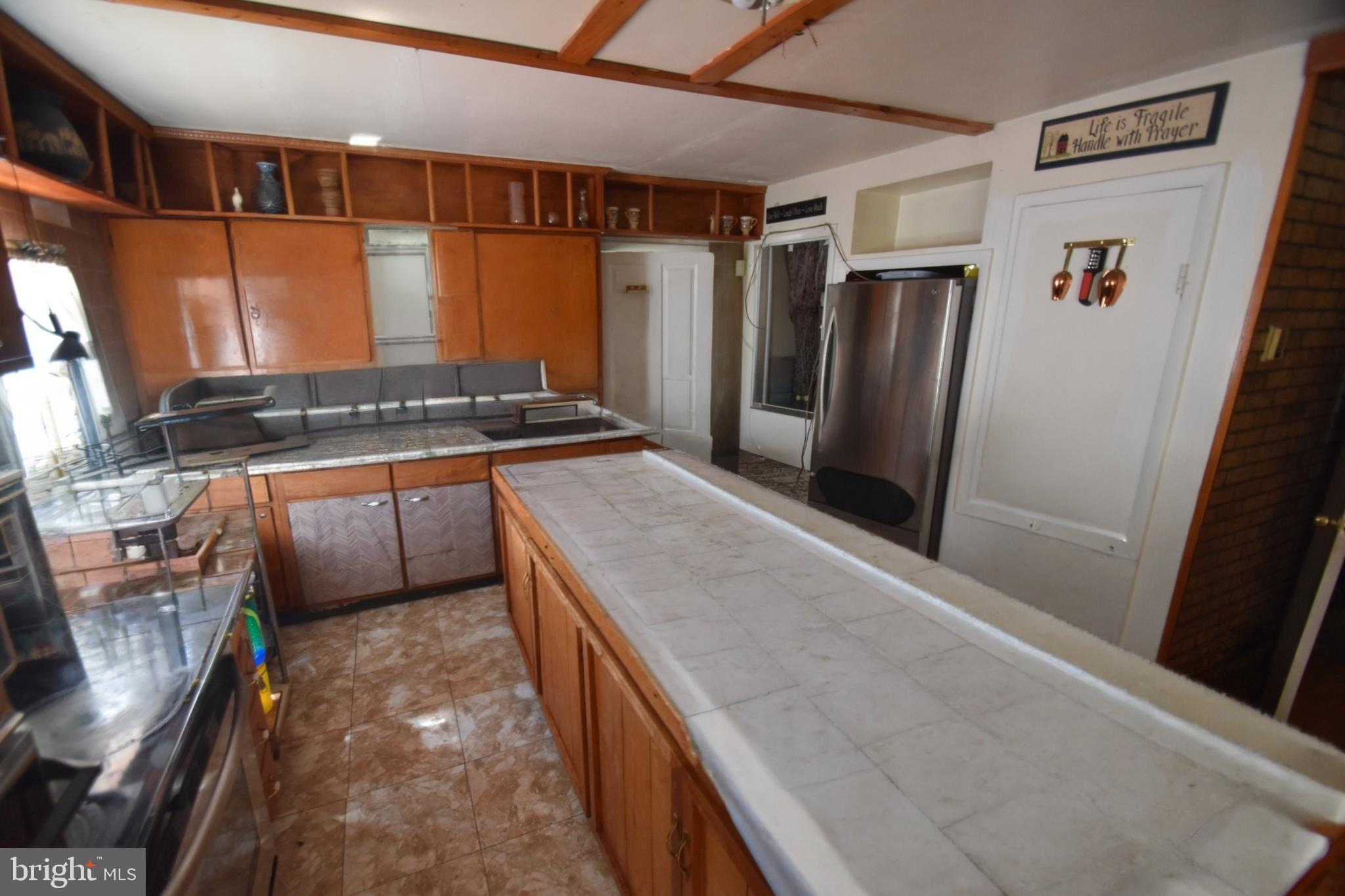2038 Marsh Road Wilmington, DE 19810 - Photo 15 of 53 a kitchen with stainless steel appliances granite countertop a refrigerator and a stove