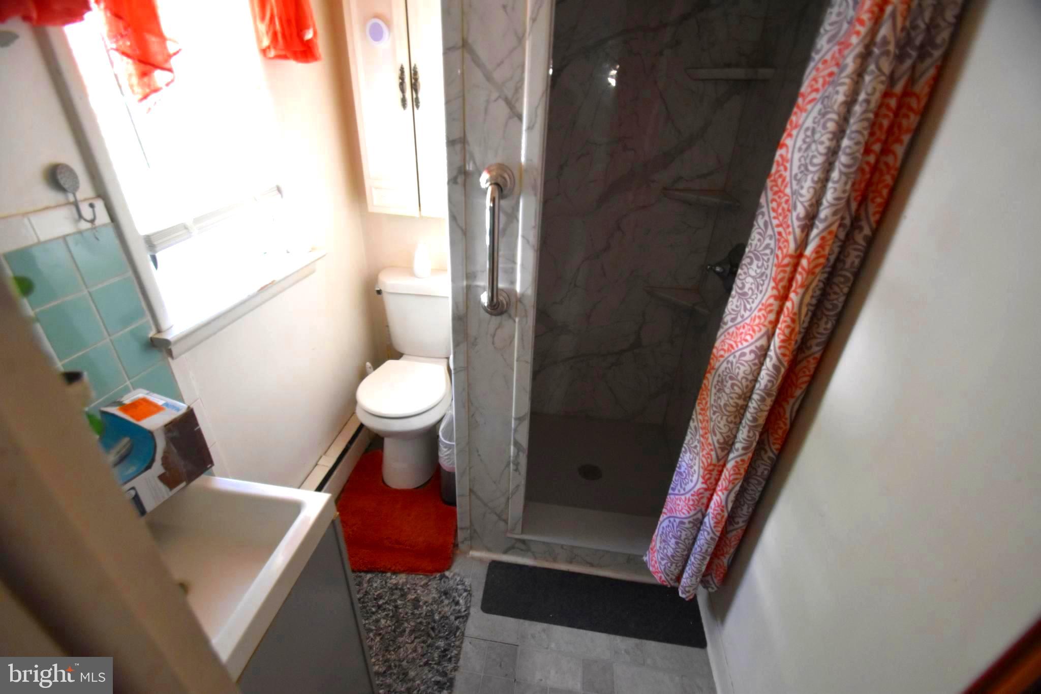 2038 Marsh Road Wilmington, DE 19810 - Photo 22 of 53 a bathroom with a sink and toilet