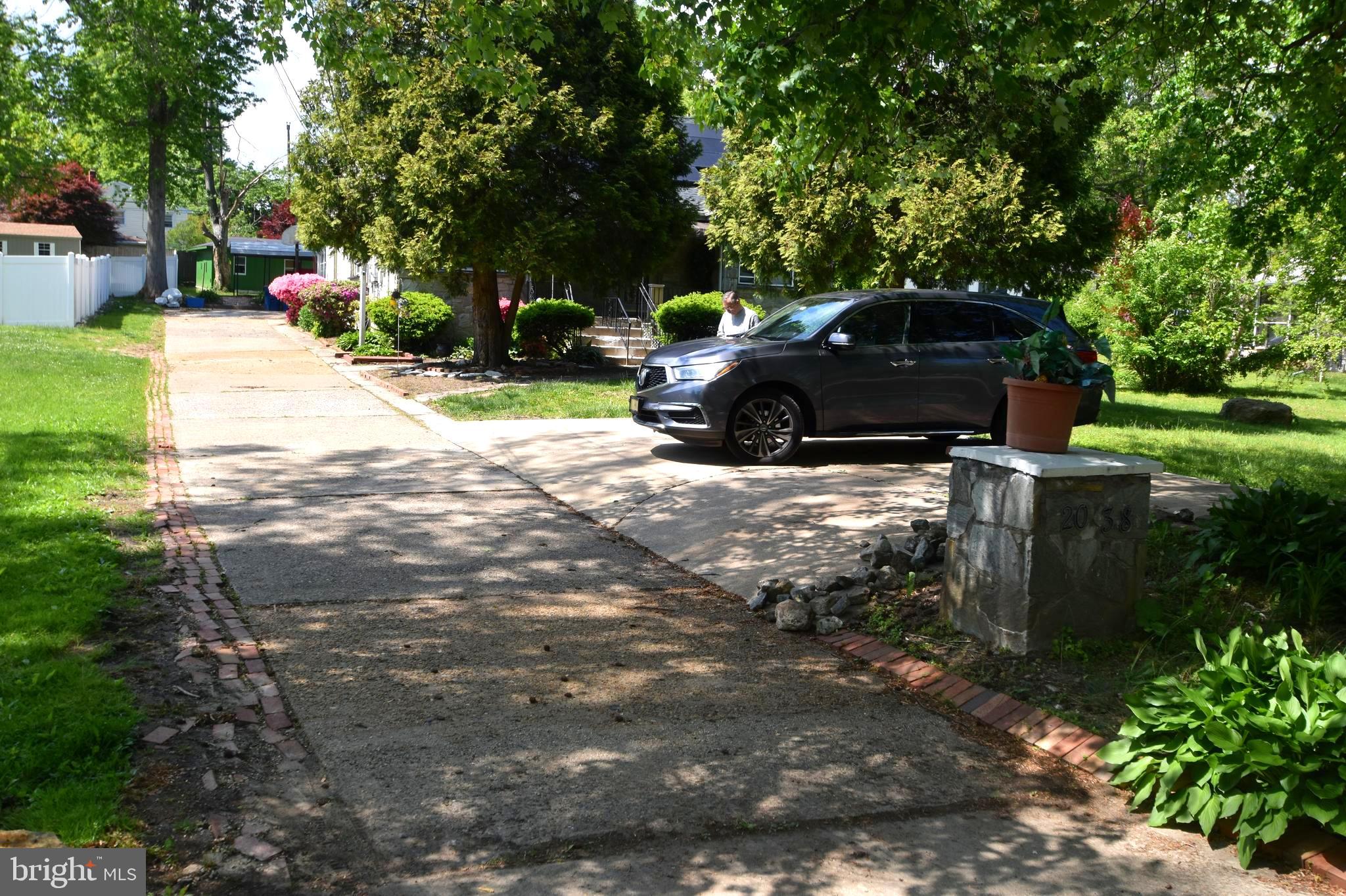 2038 Marsh Road Wilmington, DE 19810 - Photo 3 of 53 a view of a yard with car parked