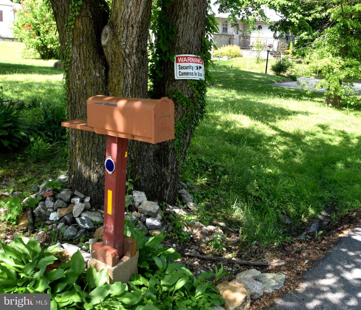 2038 Marsh Road Wilmington, DE 19810 - Photo 4 of 53 a sign that is sitting in the forest