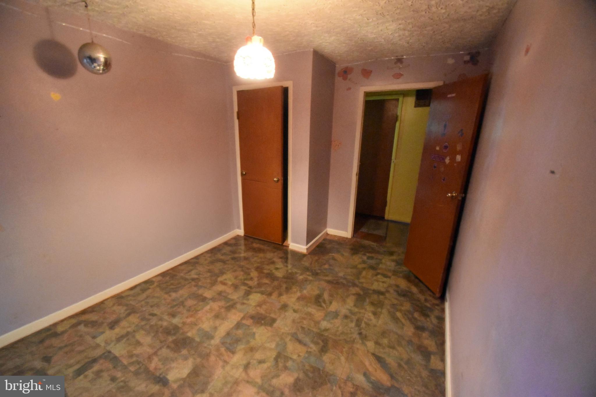 2038 Marsh Road Wilmington, DE 19810 - Photo 48 of 53 a view of an empty room with wooden floor and closet