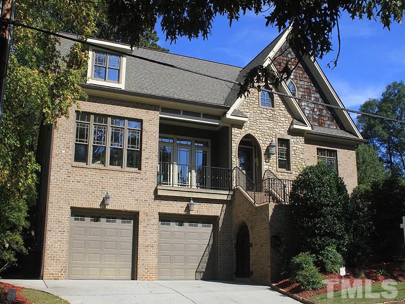 1405 Jarvis Street Raleigh, NC 27608 - Photo 2 of 25 a front view of a house with a garden
