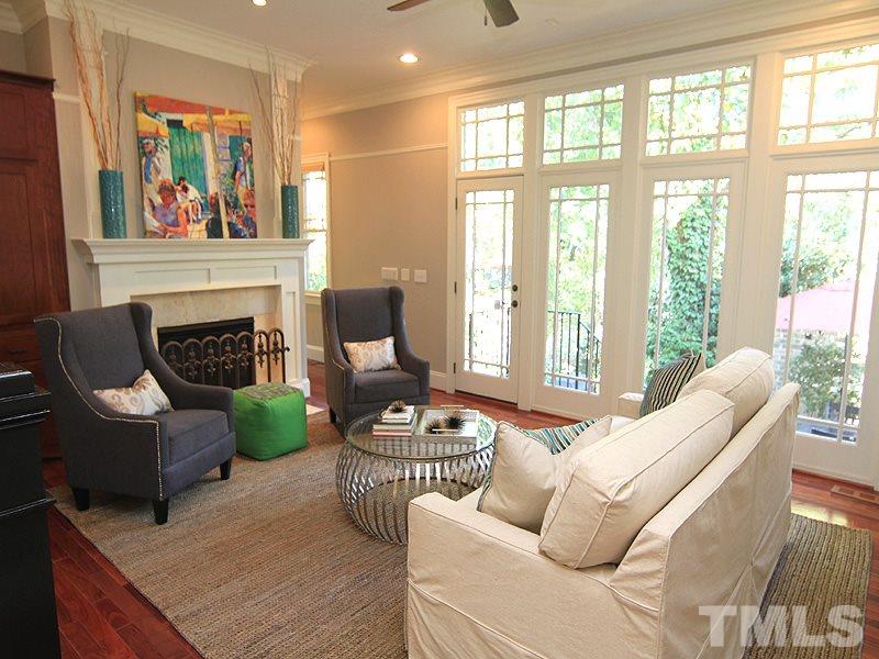 1405 Jarvis Street Raleigh, NC 27608 - Photo 11 of 25 a living room with furniture and a fireplace