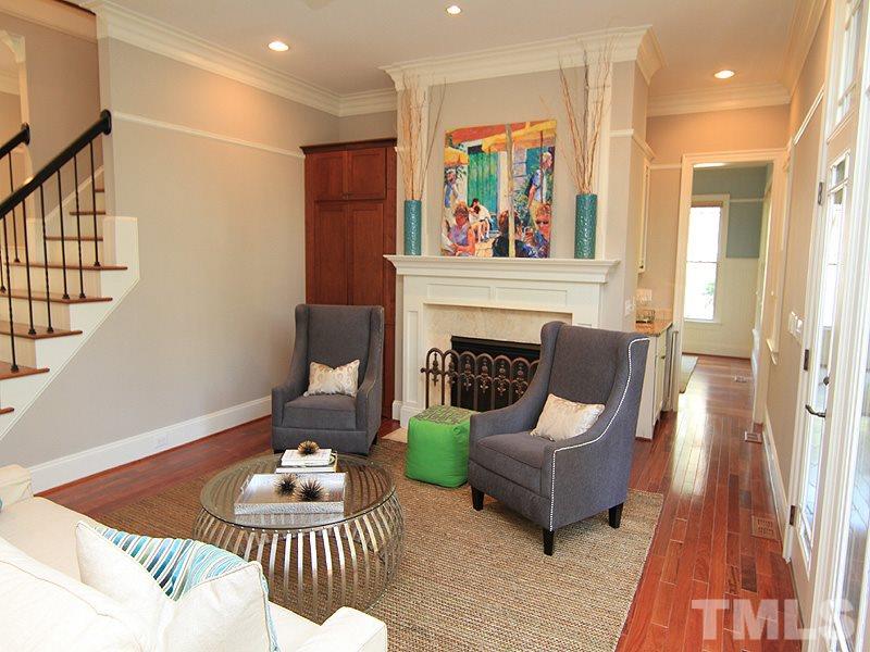 1405 Jarvis Street Raleigh, NC 27608 - Photo 12 of 25 a living room with furniture and a fireplace