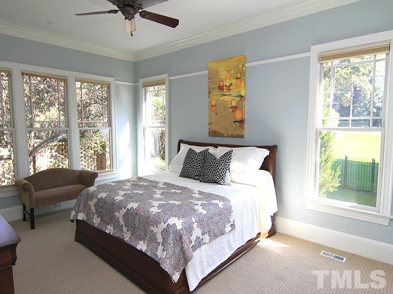 1405 Jarvis Street Raleigh, NC 27608 - Photo 13 of 25 a bedroom with bed and window