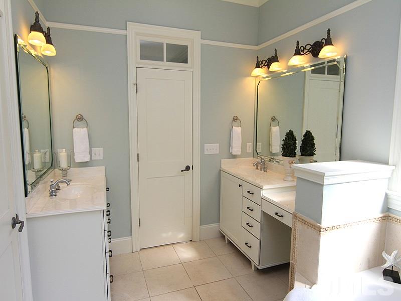 1405 Jarvis Street Raleigh, NC 27608 - Photo 15 of 25 a bathroom with a double vanity sink mirror and