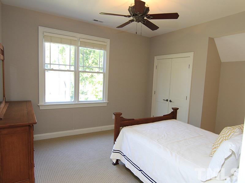 1405 Jarvis Street Raleigh, NC 27608 - Photo 16 of 25 a bedroom with a bed and a window