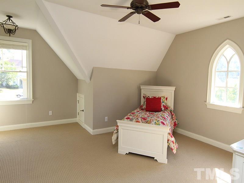 1405 Jarvis Street Raleigh, NC 27608 - Photo 18 of 25 a bedroom with a bed and window