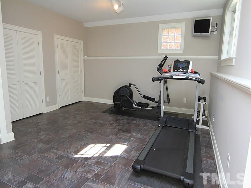 1405 Jarvis Street Raleigh, NC 27608 - Photo 22 of 25 a room with gym equipment and a window