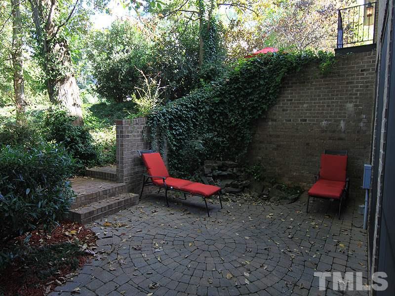 1405 Jarvis Street Raleigh, NC 27608 - Photo 24 of 25 a view of a yard with furniture and wooden fence