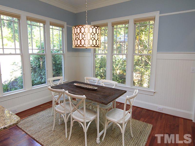 1405 Jarvis Street Raleigh, NC 27608 - Photo 7 of 25 a view of a dining room with furniture and wooden floor