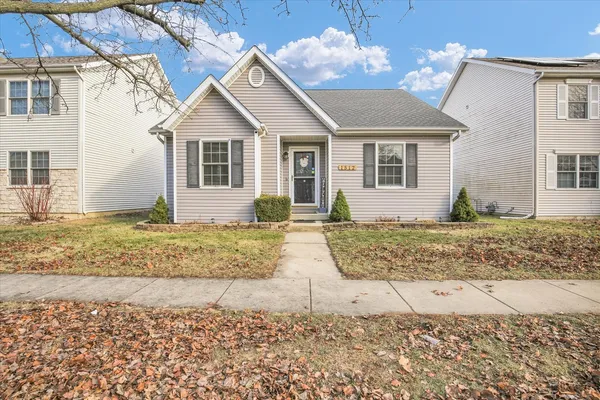 a view of a house with a yard