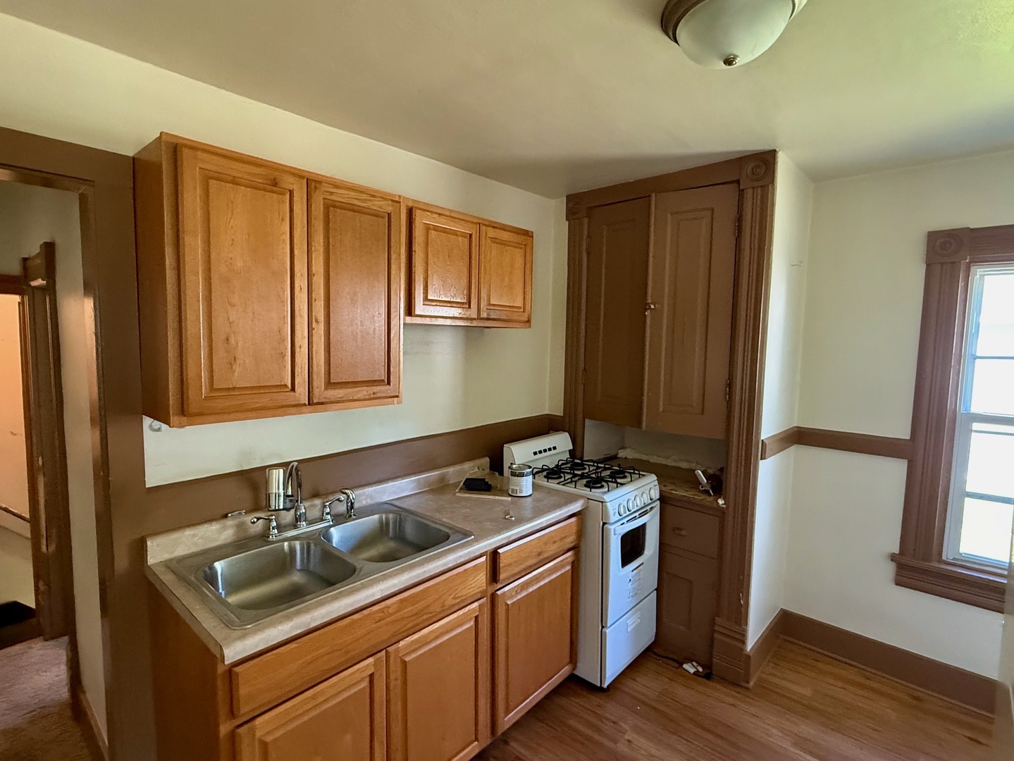 913 West 4th Street Dixon, IL 61021 - Photo 4 of 8 a kitchen with stainless steel appliances granite countertop a sink stove and refrigerator