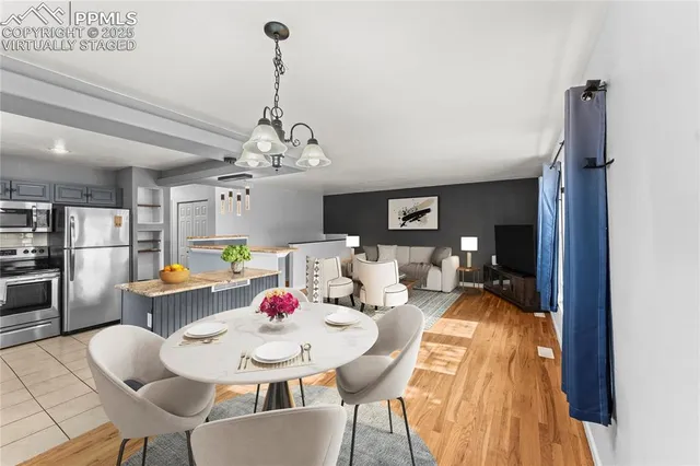 a view of a dining room with furniture window and wooden floor