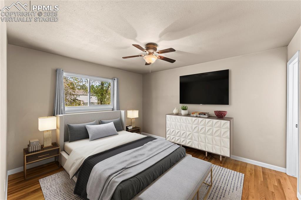 526 Griffith Way Colorado Springs, CO 80911 - Photo 17 of 46 a bedroom with bed and a flat screen tv