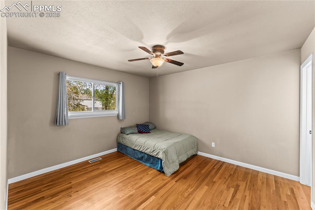526 Griffith Way Colorado Springs, CO 80911 - Photo 18 of 46 a bedroom with a bed and a window