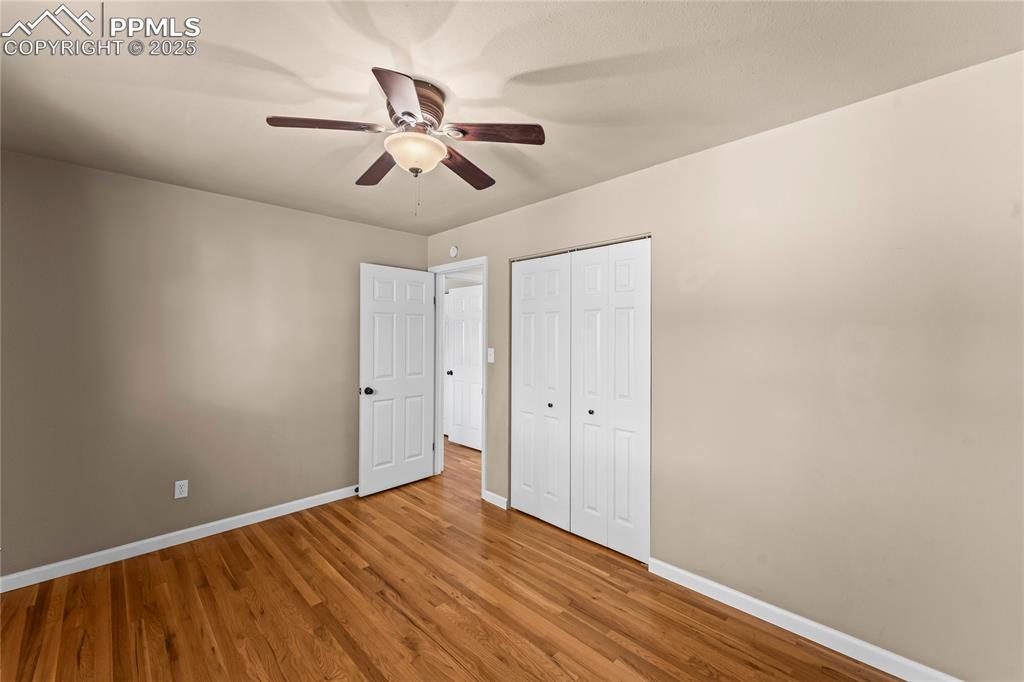 526 Griffith Way Colorado Springs, CO 80911 - Photo 23 of 46 a view of room with wooden floor
