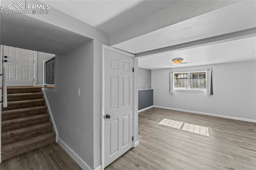 526 Griffith Way Colorado Springs, CO 80911 - Photo 26 of 46 a view of an entryway with wooden floor