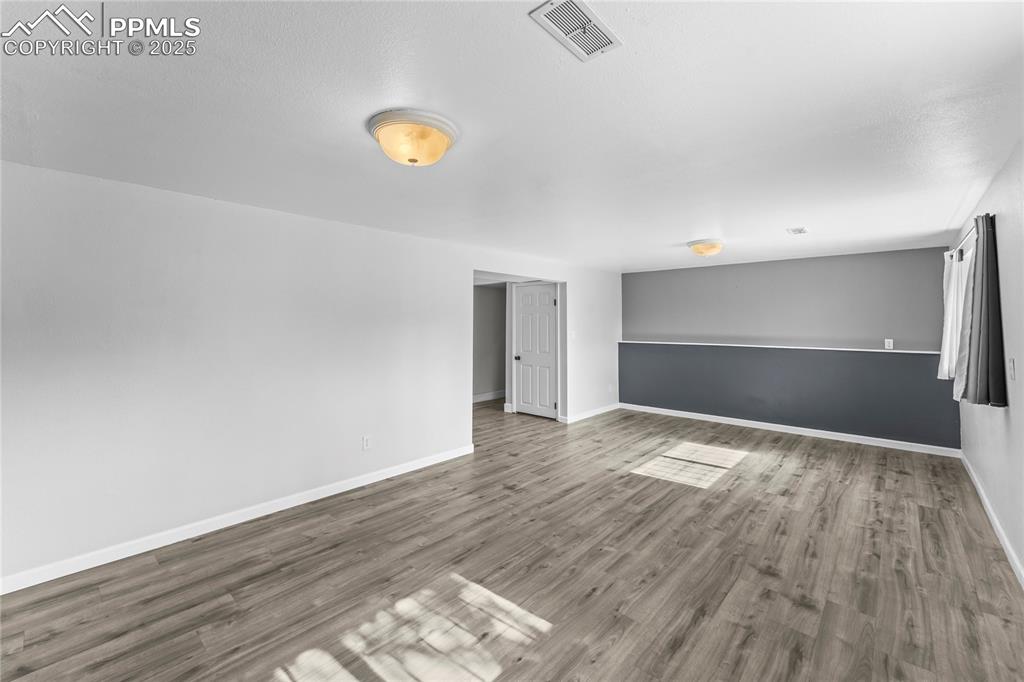 526 Griffith Way Colorado Springs, CO 80911 - Photo 29 of 46 a view of empty room with wooden floor