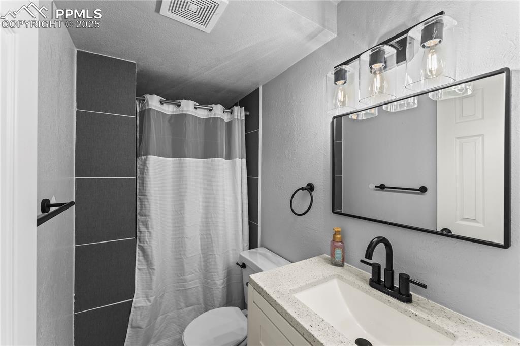 526 Griffith Way Colorado Springs, CO 80911 - Photo 31 of 46 a bathroom with a sink toilet and shower