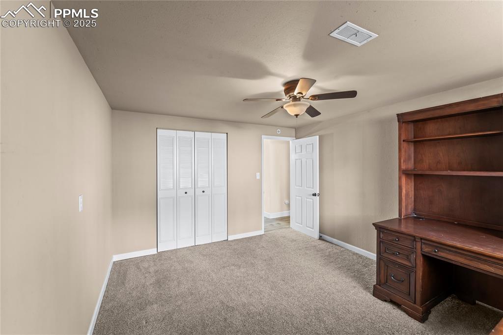 526 Griffith Way Colorado Springs, CO 80911 - Photo 33 of 46 a view of room with a ceiling fan