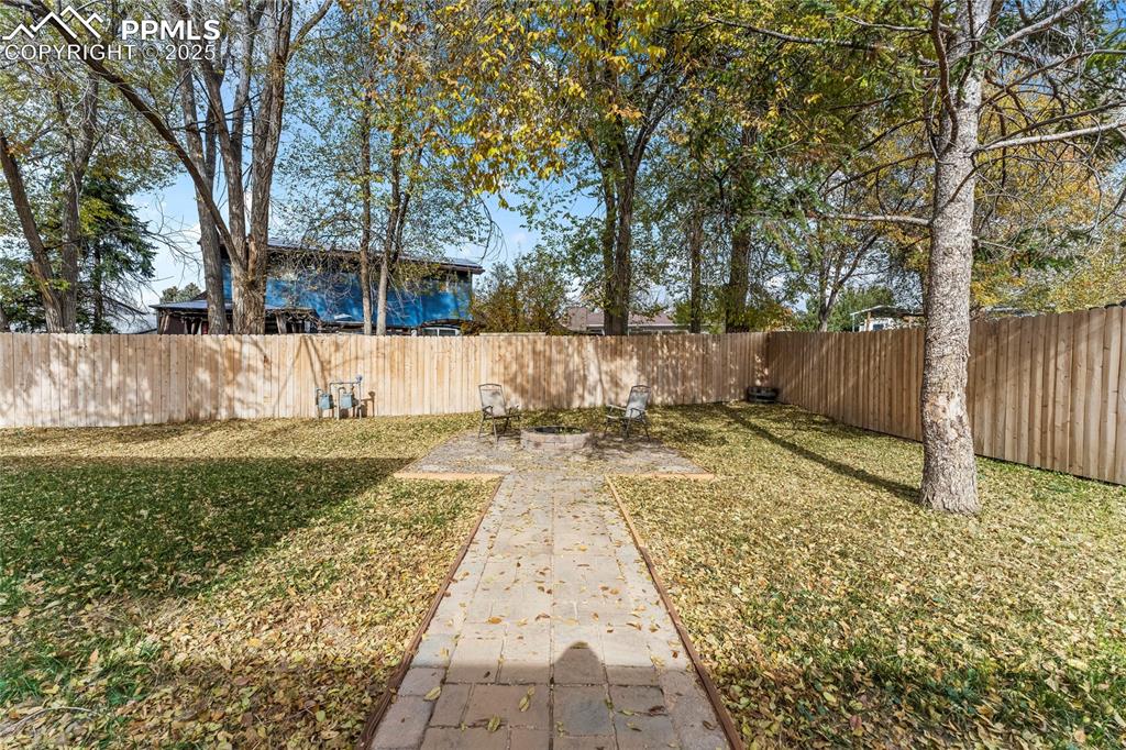 526 Griffith Way Colorado Springs, CO 80911 - Photo 38 of 46 a view of a yard with large trees