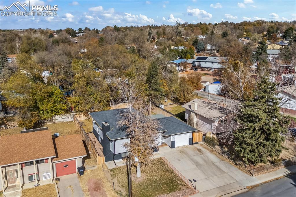 526 Griffith Way Colorado Springs, CO 80911 - Photo 5 of 46 an aerial view of a house with a yard and mountain view in back