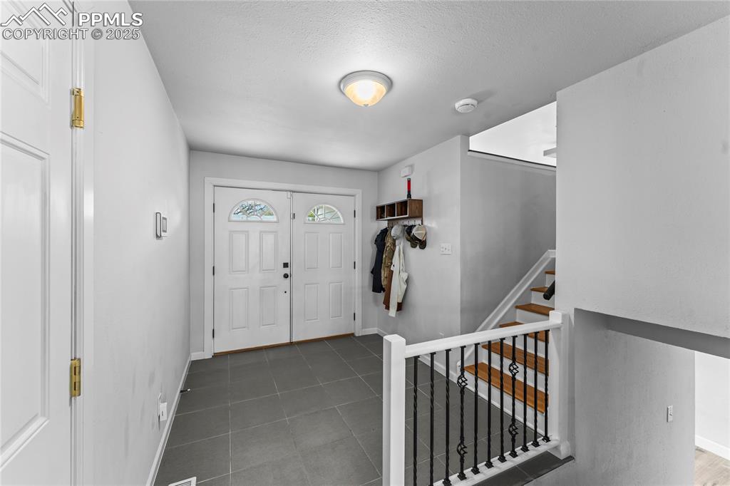 526 Griffith Way Colorado Springs, CO 80911 - Photo 6 of 46 a view of hallway with stairs