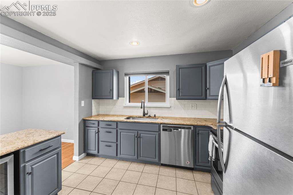 526 Griffith Way Colorado Springs, CO 80911 - Photo 9 of 46 a kitchen with a sink stove and cabinets